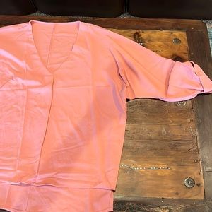 Blouse with 3/4 sleeves. More peachy than orange